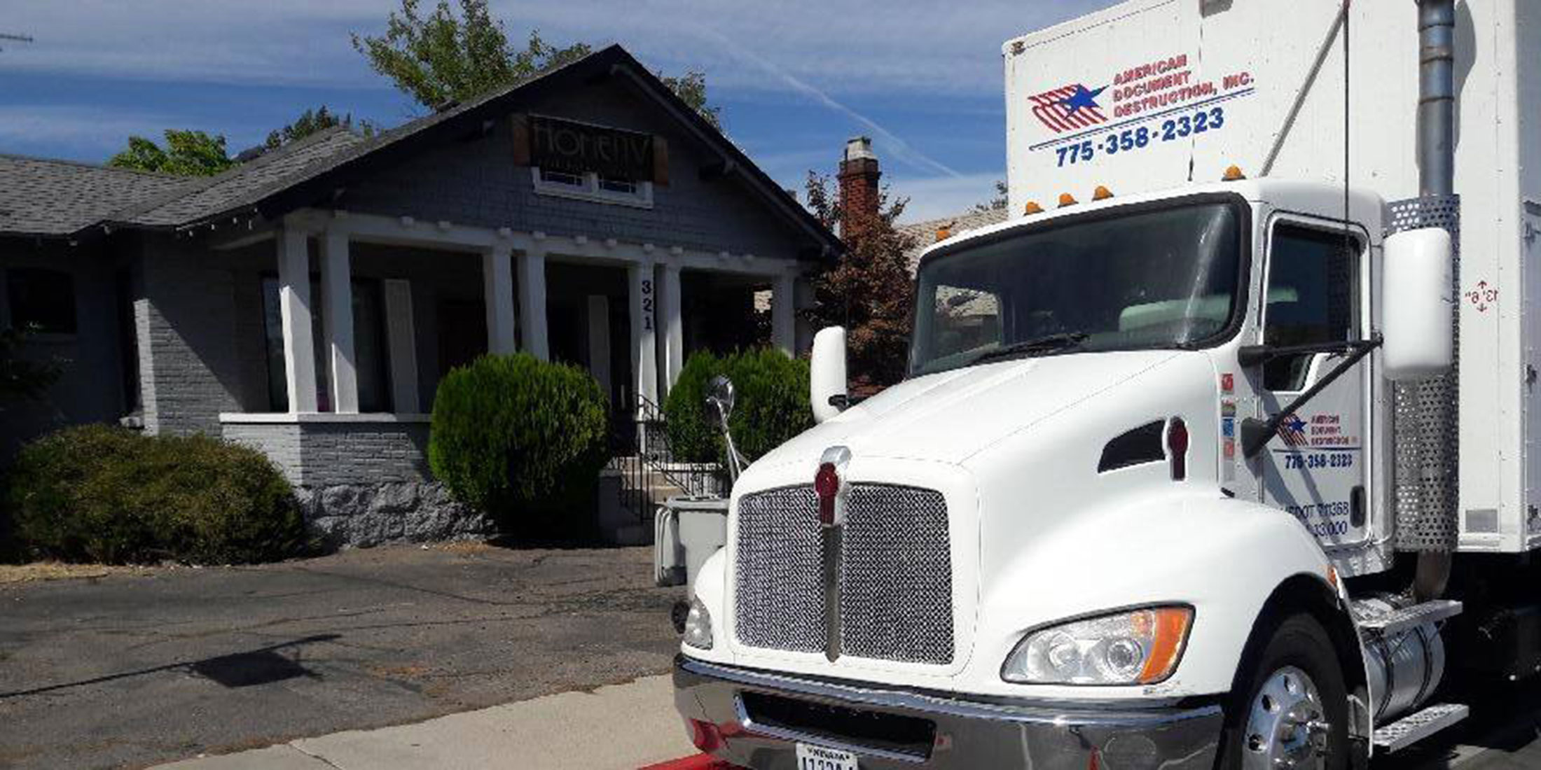 American Document Destruction truck in front of residential home